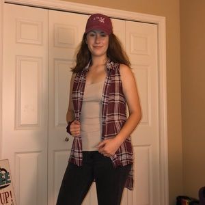 sleeveless plaid button up and tan tank top